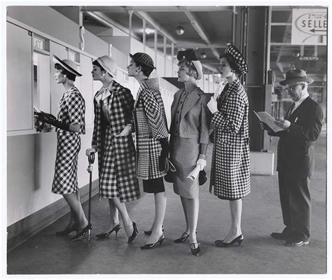 Women Wearing Checked Outfits Waiting To Place Bets At Racetrack