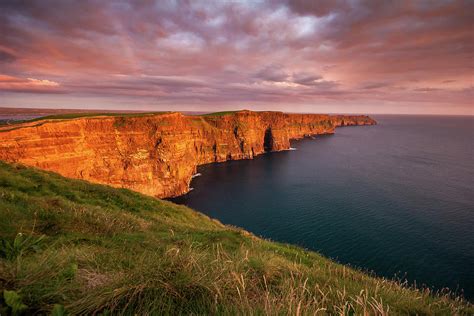 The Iconic Cliffs Of Moher At Sunset On The West Coast Of Ireland