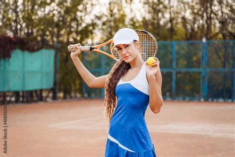 Beautiful Woman Posing On A Clay Tennis Court After The Game An Attractive Sexy Lady In A