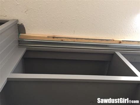 Fix in your rail for the door and get the frame ready. Easy DIY Sliding Doors for Cabinets - Sawdust Girl®
