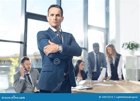 Handsome Businessman Looking At Camera With Crossed Arms Stock Image