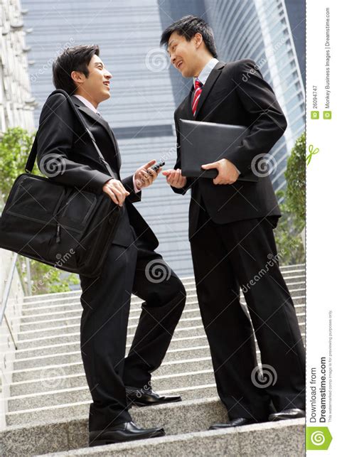 Two Chinese Businessmen Having Discussion Stock Image Image Of
