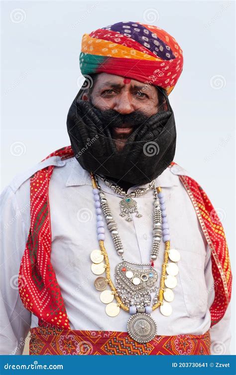 Indian Man In Traditional Clothes Poses For A Photo During Camel Festival In Rajasthan India
