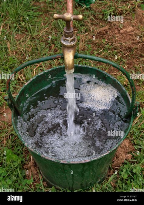 Bucket Being Filled With Water UK Stock Photo Alamy