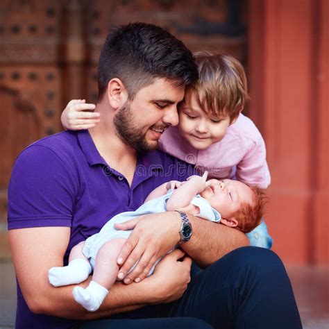 Portrait Of Happy Father With Newborn Baby And Son Stock Photo Image