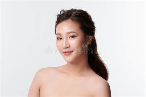 Beautiful Young Asian Woman With Clean Fresh Skin On White Background