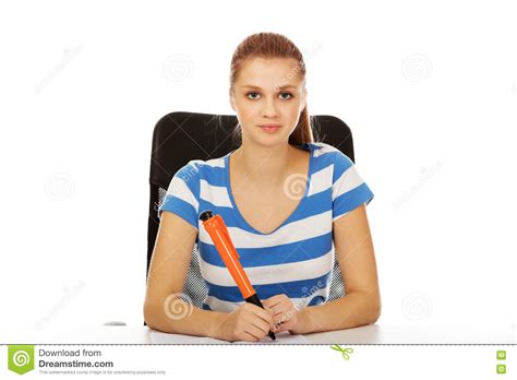 Pretty Teenager Woman Writing Something With Huge Pen Stock Image