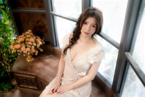 Simply create a side part and pin back the shallow side using a bobby pin (flower optional). Asian Women Model Long Hair Brunette Sitting Braided Hair ...