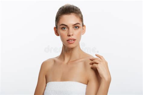 Beautiful Girl With Nude Make Up Posing At White Studio Background