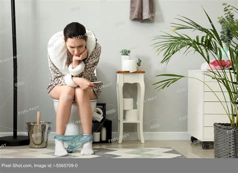 Babe Woman Suffering From Constipation On Toilet Bowl At Home Stock Photography Agency
