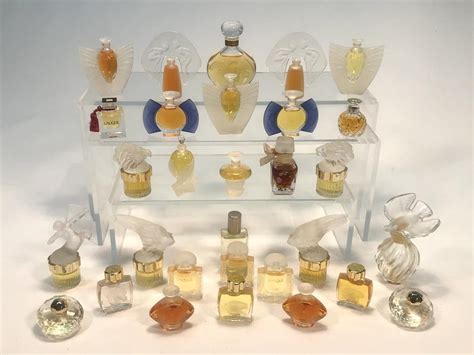 Sold Price A Collection Of Twenty Four Lalique Miniature Perfume