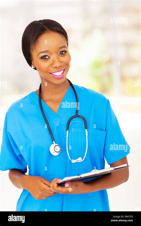 Pretty Female African Medical Nurse Holding Clipboard Stock Photo Alamy