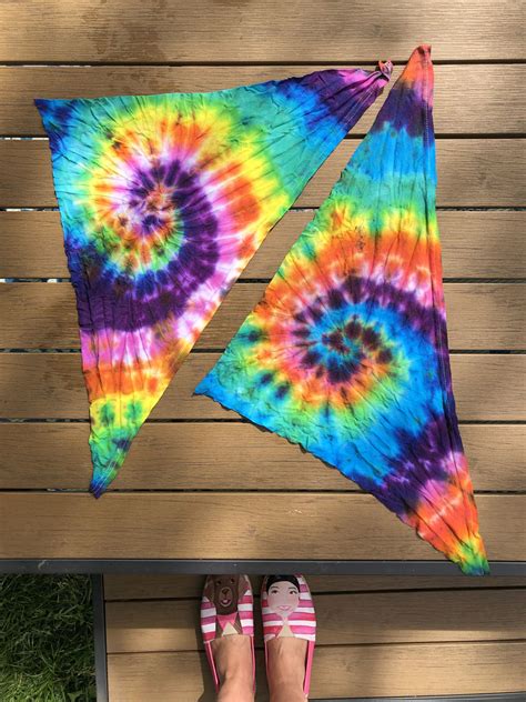 You can use a dog brush or comb to make sure the mixture gets through the entire coat or to create patterns. DIY Rainbow Tie Dye Dog Bandana | Wear Wag Repeat