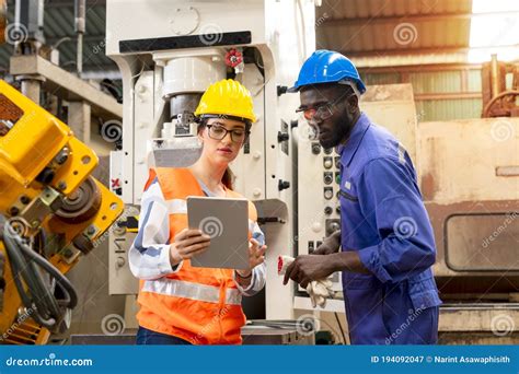 Supervisor Worker With Hard Hat Working In Manufacturing Factory On