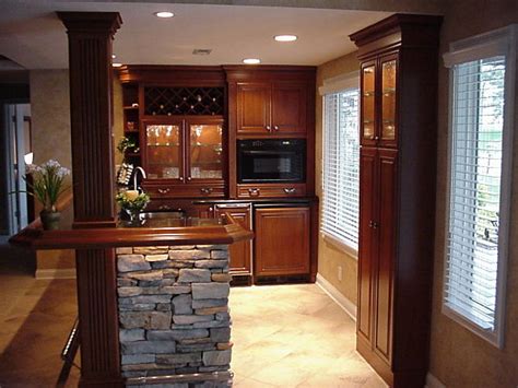 Basement storage bins corral toys, office supplies, and media items. 7 Design Ideas for Basement Kitchens