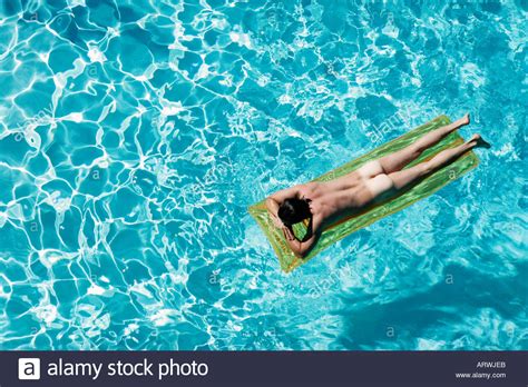 Nude Man Lying On Floating Mattress In Swimming Pool Stock Photo My