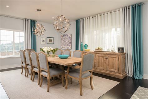 Great room anchored by the large fireplace with large sliding glass doors that open up to the outside patios. Gray and Teal Dining Room - Contemporary - Dining Room ...