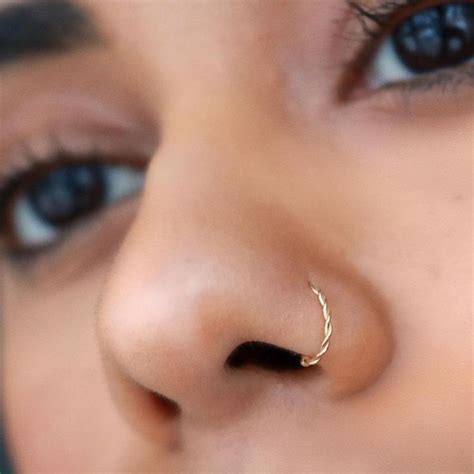 I got my nose pierced in late august/early september i'm really afraid that the piercing has closed over partially, and that the ring is just hanging in two separate holes in my nose that is separated by it might also help to put a dab of oil on the outside of the piercing. Pin on what to wear