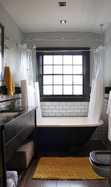 Give your bathroom a touch of glam by choosing a glossy black clawfoot tub accented with striking gold feet. Clawfoot tub + shower, subway tile, reclaimed wood floors ...