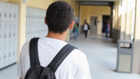 High School Student Walking Along Hallway Stock Video Footage - Storyblocks