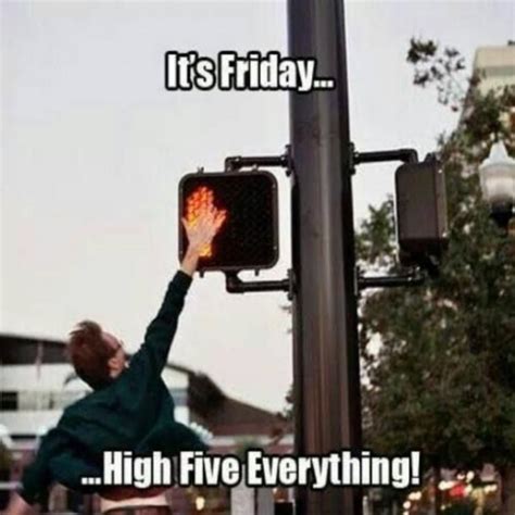 A Person Reaching Up To A Traffic Light That Says Its Friday High Five