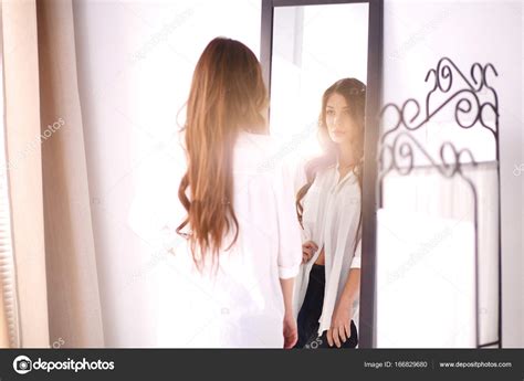 girl looking at mirror telegraph