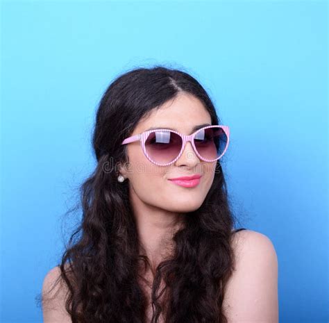 Portrait Of Woman With Retro Glasses Against Blue Background Stock