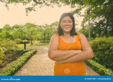 Beautiful Overweight Asian Woman Relaxing At The Park In The City Of