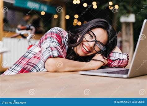 Excited Female Freelancer With Tanned Skin Having Fun During Work