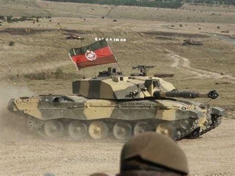 A Challenger 2 In Desert Camouflage Flying The Flag Of The Royal Tank