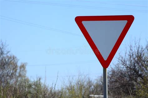 Traffic Sign In The Form Of A White Triangle Give Way Stock Photo