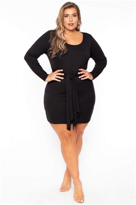 This Plus Size Stretch Knit Ribbed Dress Features A Scoop Neckline