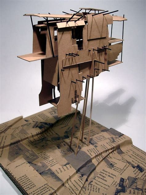 A Sculpture Made Out Of Cardboard Sitting On Top Of A Piece Of Paper