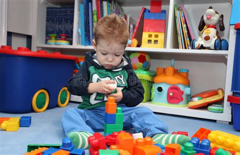 A Baby Boy Playing With Plastic Blocks Stock Photo Image