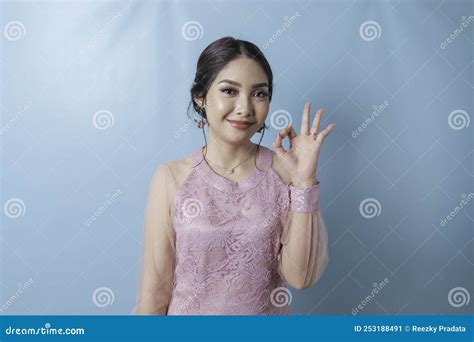 Excited Asian Woman Wearing Modern Kebaya Clothes Giving Ok Hand