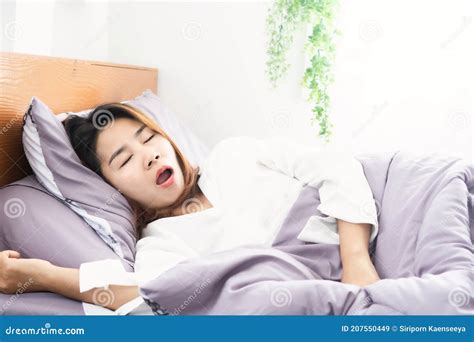 Asian Woman Snoring And Open Mouth While Sleeping In Bed Stock Image
