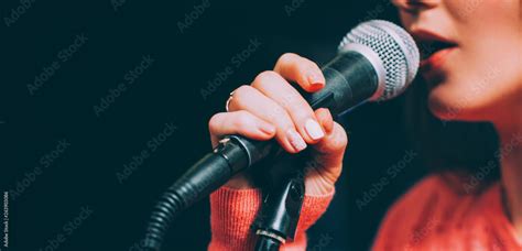 Singer At Microphone Woman Singing And Holding Mic Female Vocal