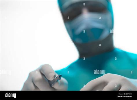 Surgeon scrubs hand scalpel Doctor contribution contributions