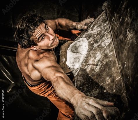 Muscular Man Practicing Rock Climbing Stock Photo And Royalty Free