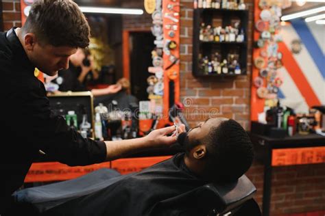 Visiting Barbershop African American Man In A Stylish Barber Shop