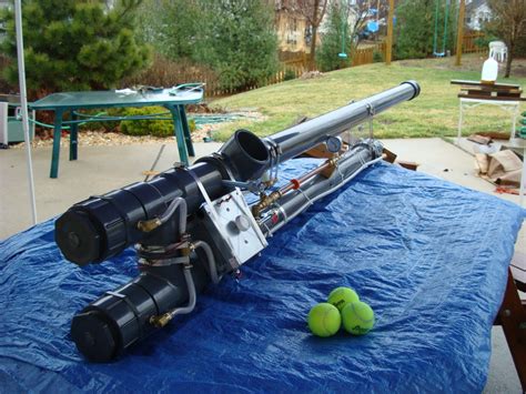 Hook the plane to the elastic, draw back and fire! Propane Tennis Ball Cannon (2011) | James Zandstra