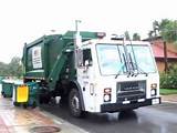 Garbage Trucks On Route In Action Pictures