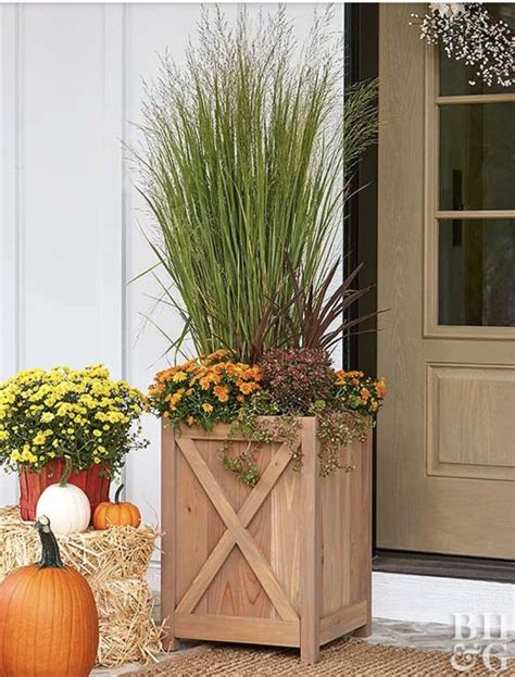 Wooden X Planter With Tall Ornamental Grass And Flowers Tall Planter