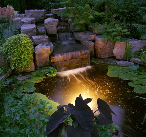 For a lot of people the fish or the water lilies may be your favourite part, but few will deny that it's the waterfall that really makes the garden. 50 Pictures of Backyard Garden Waterfalls (Ideas & Designs)