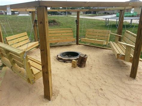 A fire pit is one type of outdoor fire feature that is an inexpensive, easy way to add a lot more fun to your backyard. Beach theme swings around a fire pit | Gardens | Pinterest