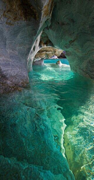 Tropical Cave Partially Submerged In Water Beaches And Water