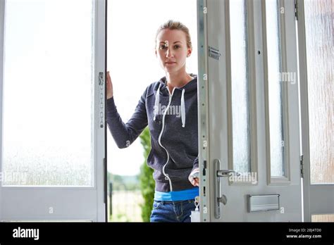 Woman Standing Outside Door Hi Res Stock Photography And Images Alamy
