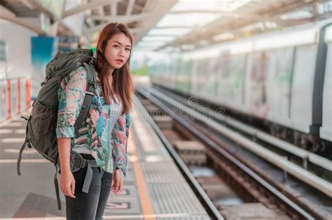 Asian Woman Traveler Tourist Waiting Modern Train At Train Station Selective Focus Travel