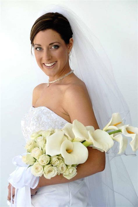 Ultra Glamorous Arm Sheaf Bridal Bouquet Comprised Of Ivory Roses