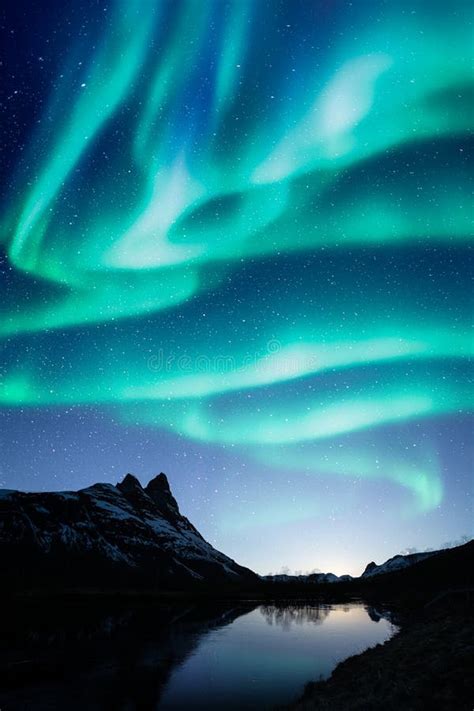 Northern Lights Aka Aurora Borealis On The Night Sky Stock Image